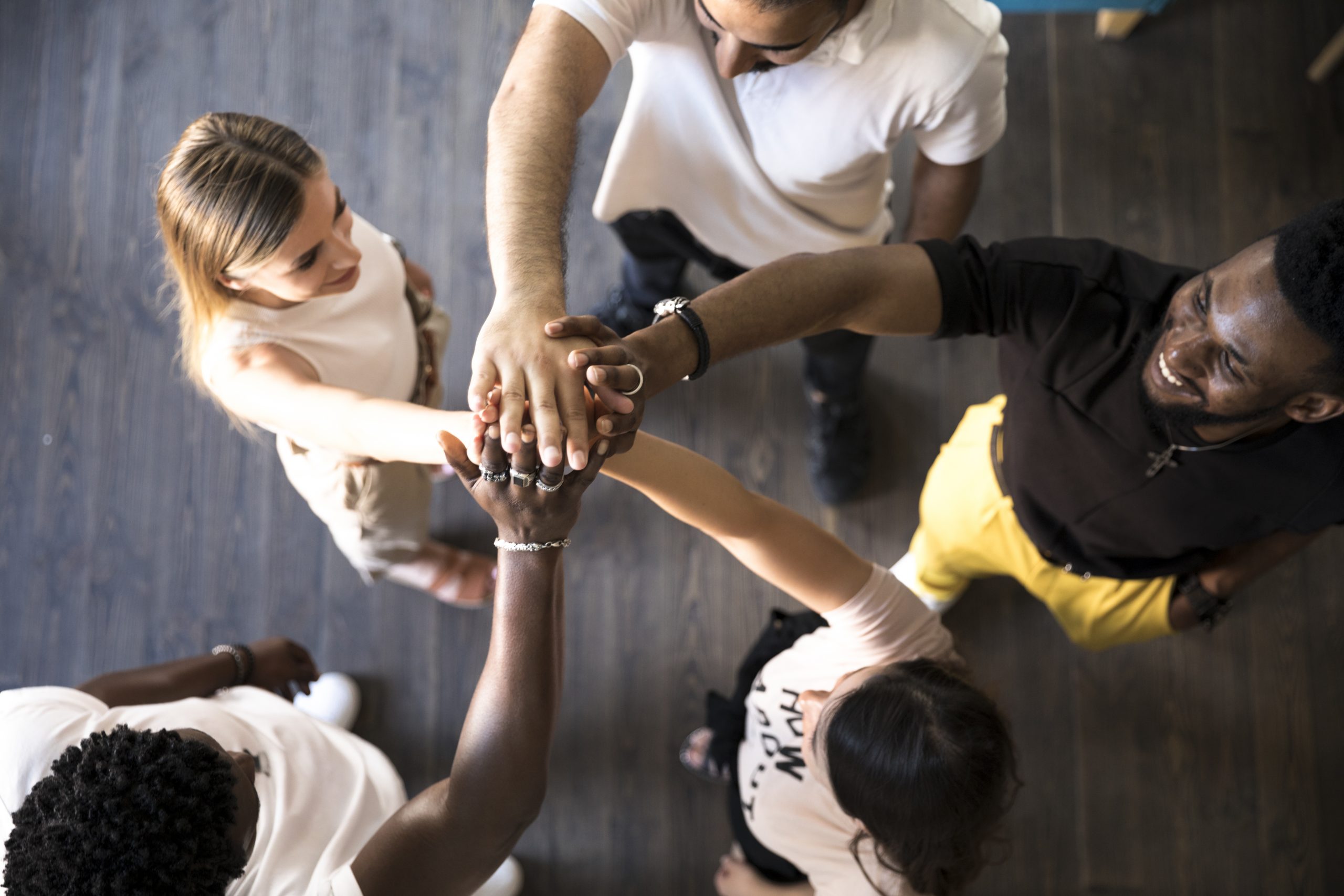 group-people-holding-their-hands-up