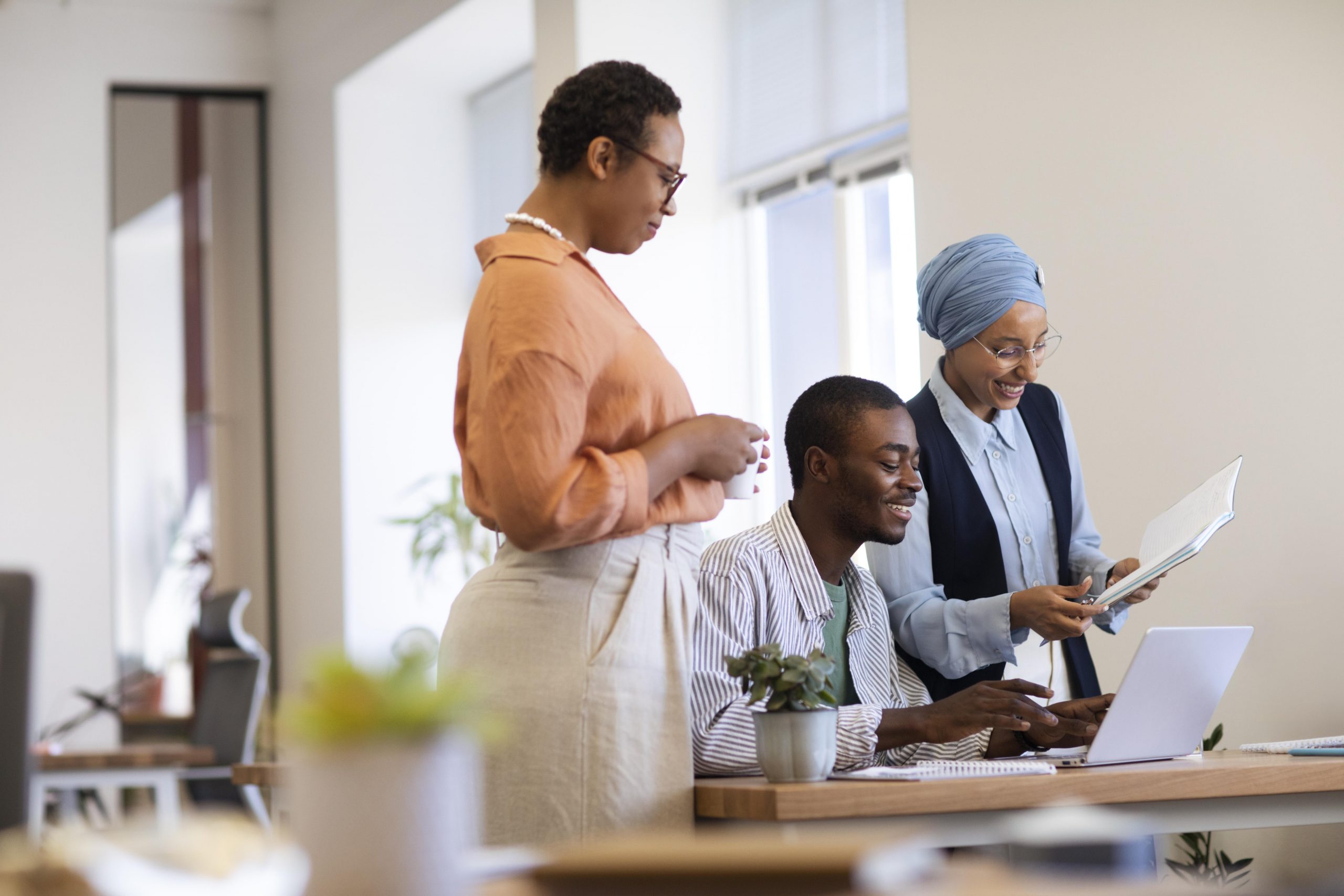 male-employee-getting-used-his-new-office-job-along-with-female-colleagues